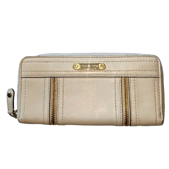 Michael Kors Handbags - Michael Kors Moxley zip around wallet in bone. Good used condition.
